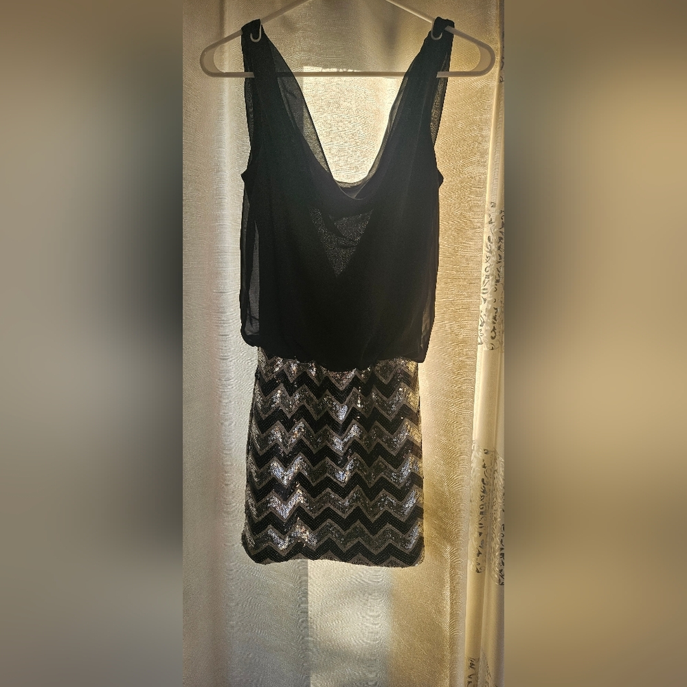 As U Wish Size Medium Black and Silver Dress. Cut out opening In the back.  #201